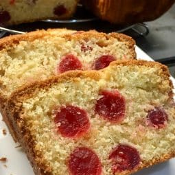 Cherry Madeira Cake , sliced on a plate