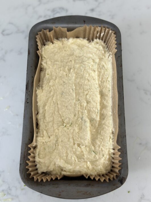 Coconut cake batter in tin